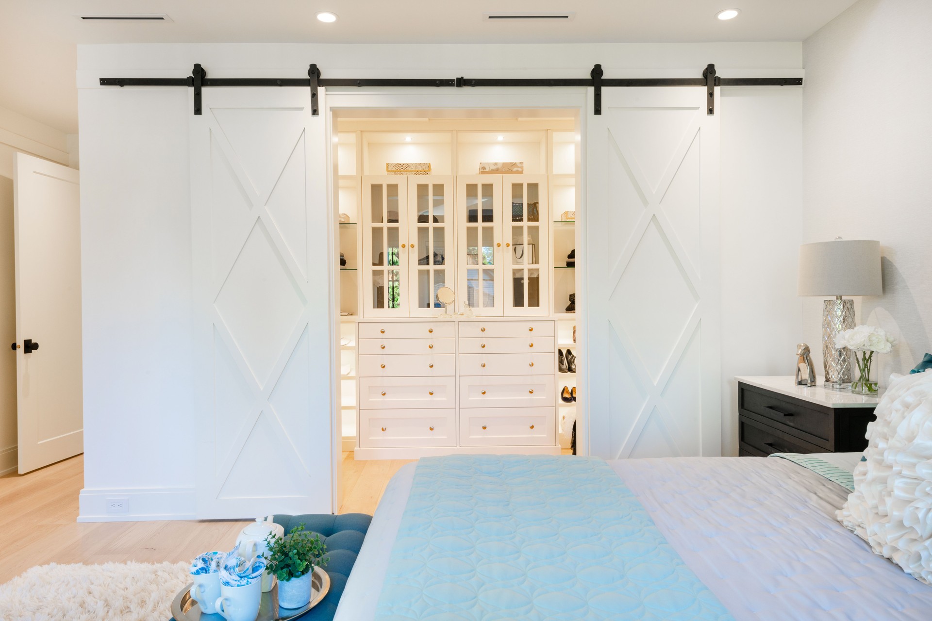 Beautiful model show home interior and exterior of a professionally staged and decorated residence. walk in closet and bedroom.
